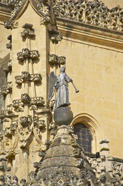 Lead angel playing trumpet cathedral Segovia Spain