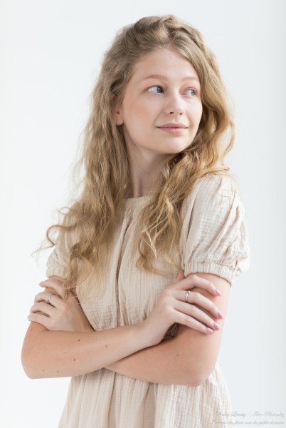 Nastia - an 18-year-old natural curly blonde girl with grey-blue eyes, photographed in June 2024 by Serhiy Lvivsky, portrait 4/14