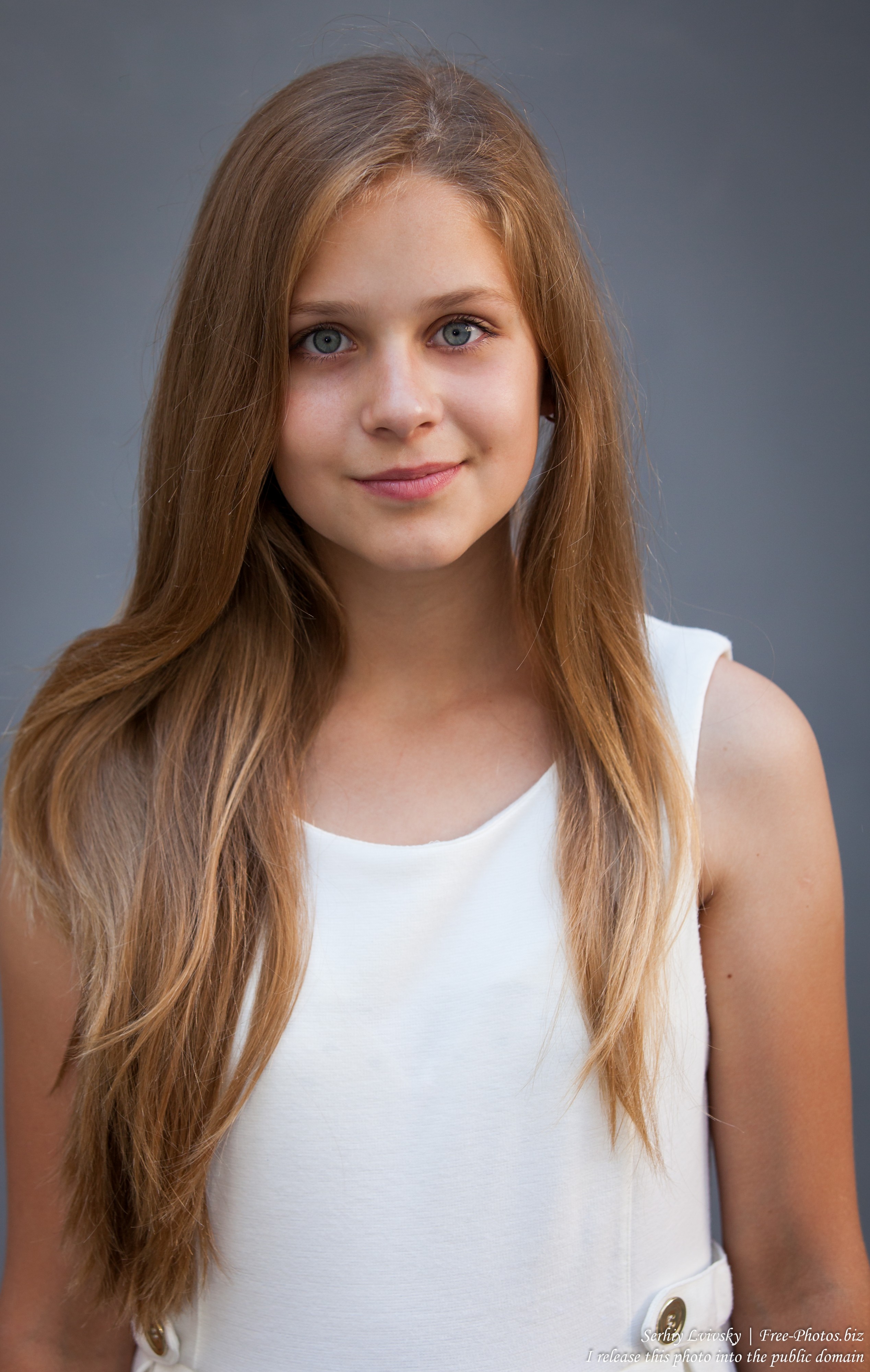 photo-of-a-12-year-old-blond-girl-wearing-a-white-dress-photographed-in