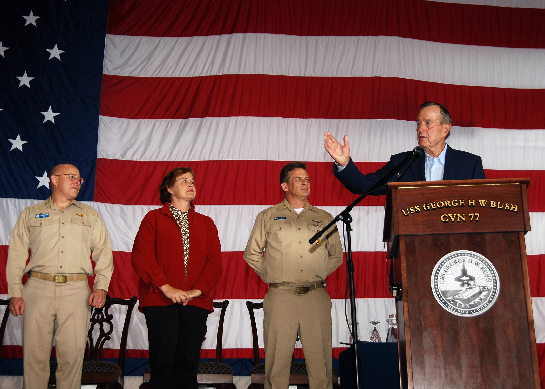 US Navy 090527-N-1981M-067 Dignitaries address the crew aboard USS George H.W. Bush during a mass re-enlistment and frocking ceremony