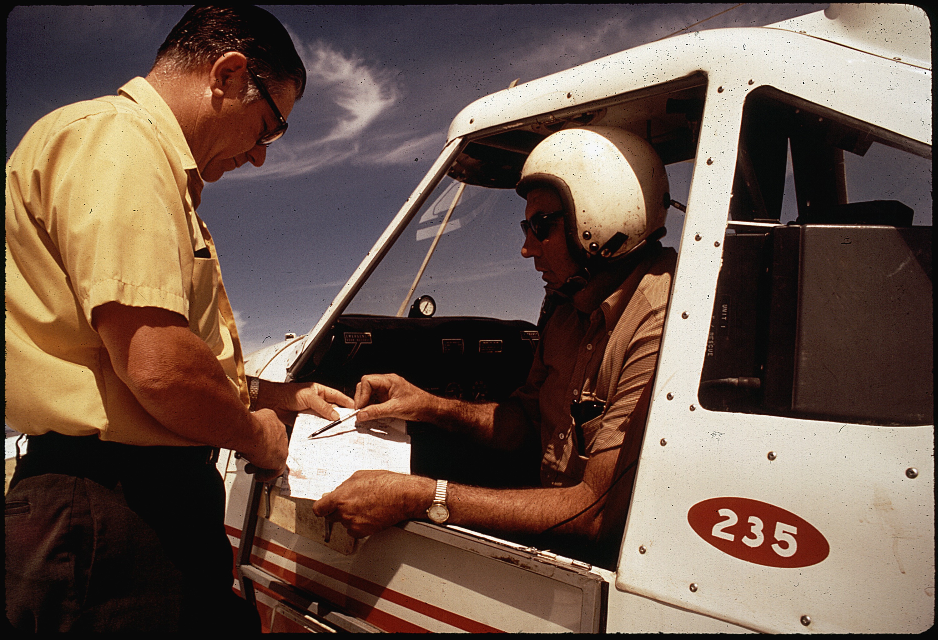 DEPUTY AGRICULTURAL COMMISSIONER CONRAD SCHILLING AND PILOT JOHN GILBERT PREPARE FOR FLIGHT OVER BARLEY FIELDS. THEY... - NARA - 542576