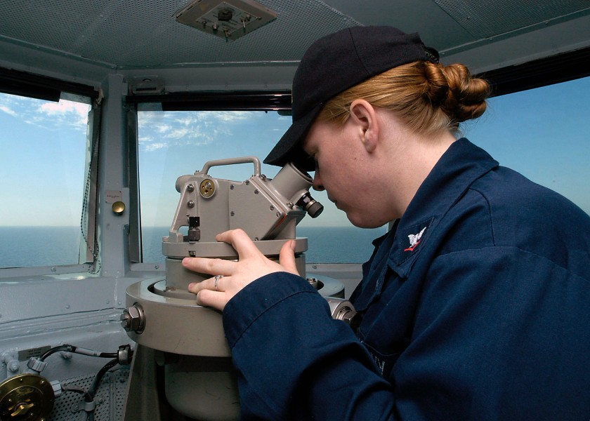 US Navy 040325-N-9630B-023 Quartermaster 3rd Class Riki Cook, of San Diego, Calif., utilizes an alidade, to take a bearing aboard USS George Washington (CVN 73)