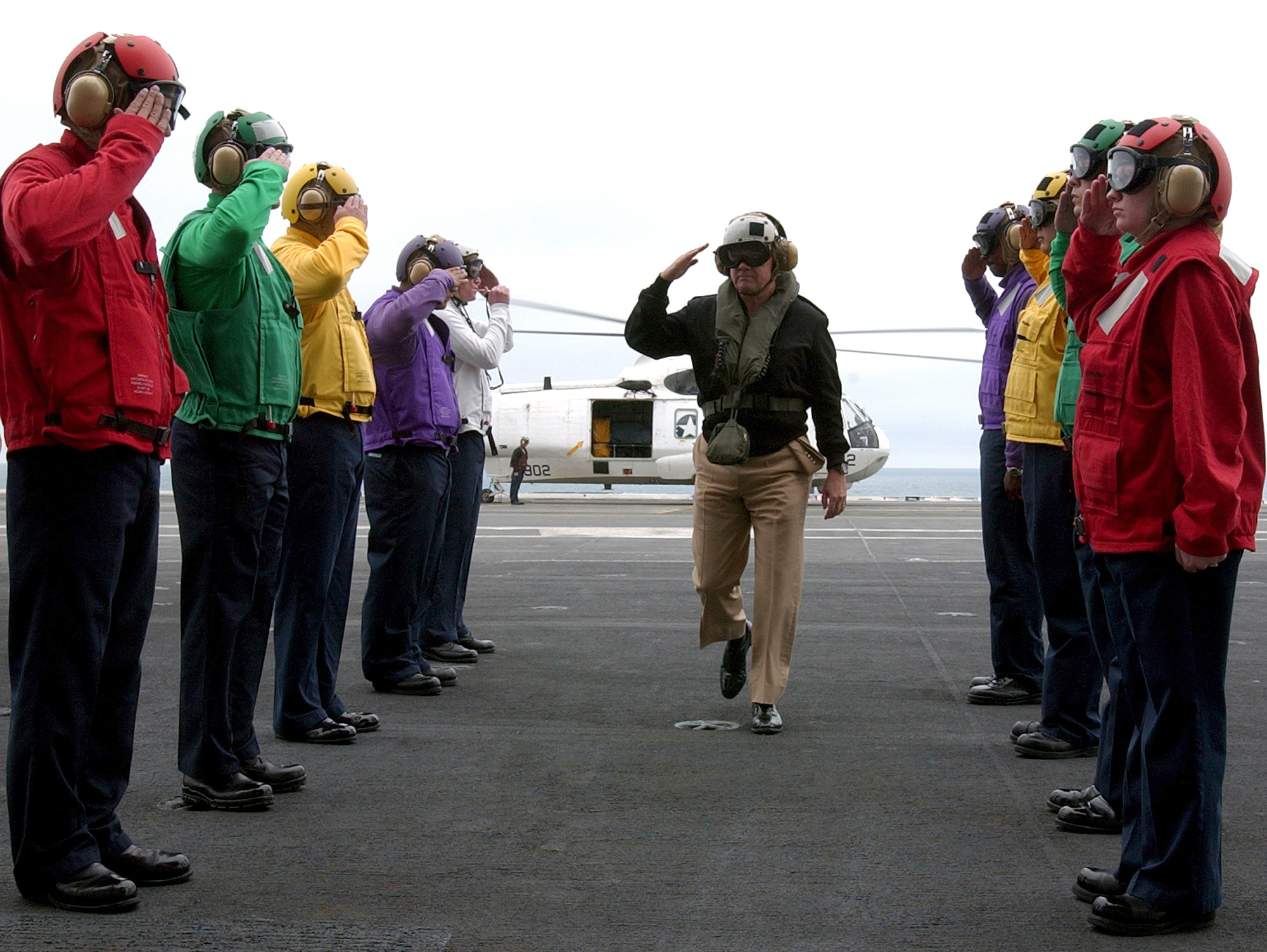 US Navy 050516-N-7130B-071 Commander, U.S. Pacific Fleet, Adm. Walter F. Doran receives official honors from rainbow sideboys as he arrives aboard the Nimitz-class aircraft carrier USS Ronald Reagan (CVN 76)