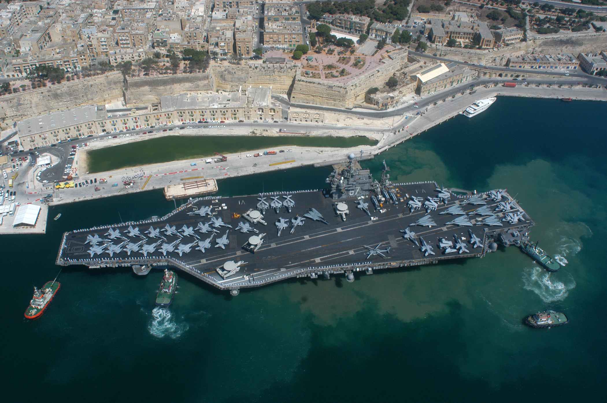 US Navy 040626-N-8704K-004 The conventionally powered aircraft carrier USS John F. Kennedy (CV 67) pulls into the port of Valletta, Malta